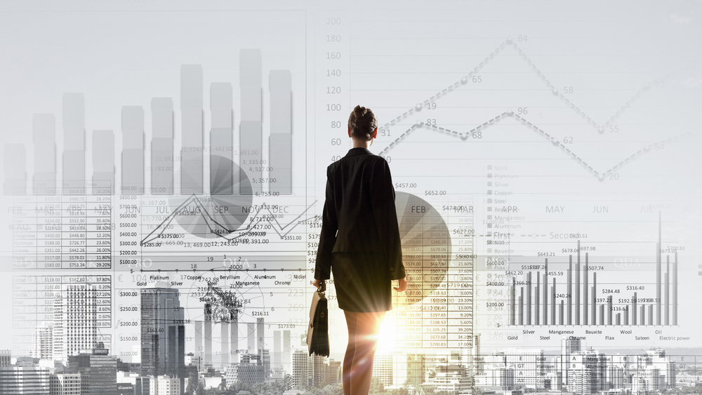 Rear view of businesswoman looking at business marketing strategy Rear view of businesswoman looking at business marketing strategy